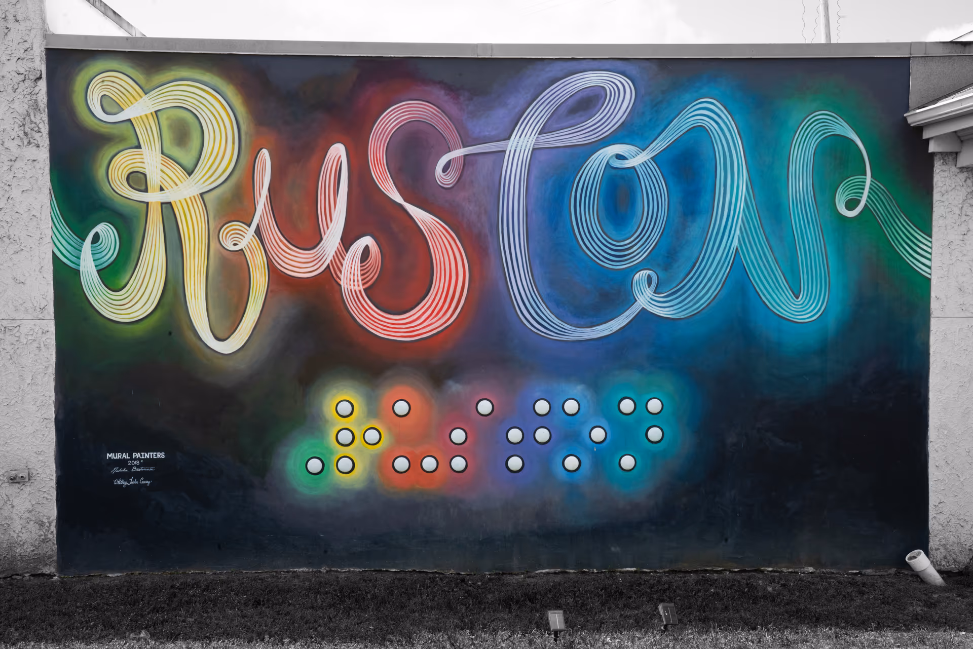 Colorful neon-script Ruston mural painted on a brick wall in downtown Ruston, Louisiana